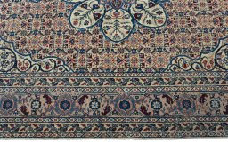 Corner detail of 1950s Tabriz rug showing border pattern and Wool pile