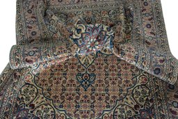 Surface texture of 1950s Tabriz rug with natural Wool and intricate pattern