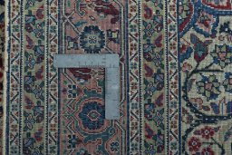 Backside of handmade 1950s Tabriz rug showing knot structure and weave density