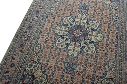Backside of handmade 1950s Tabriz rug showing knot structure and weave density
