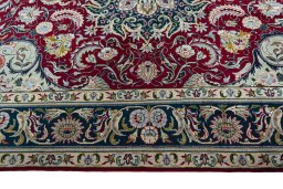 Corner detail of 2000s Tabriz rug showing border pattern and Wool pile