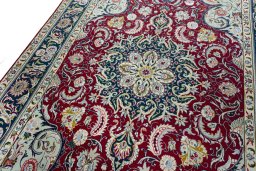 Backside of handmade 2000s Tabriz rug showing knot structure and weave density
