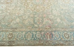Corner detail of 1950s Tabriz rug showing border pattern and Wool pile