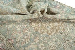 Surface texture of 1950s Tabriz rug with natural Wool and intricate pattern