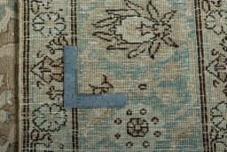 Backside of handmade 1950s Tabriz rug showing knot structure and weave density