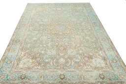 Surface texture of 1950s Tabriz rug with natural Wool and intricate pattern