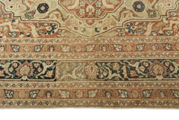 Corner detail of 1930s Tabriz rug showing border pattern and Wool pile