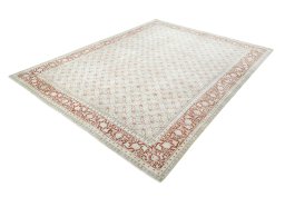 Corner detail of 2000s Tabriz rug showing border pattern and Wool pile