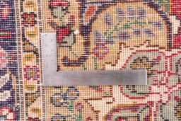 Corner detail of 1980s Tabriz rug showing border pattern and Wool pile