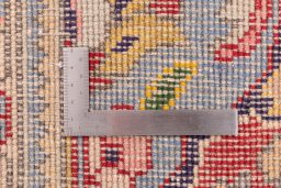 Corner detail of 2003s Tabriz rug showing border pattern and Wool pile