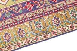 Backside of handmade 1980s Tabriz rug showing knot structure and weave density