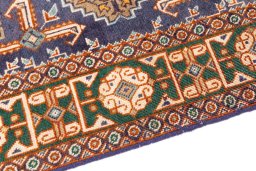 Backside of handmade 1970s Tabriz rug showing knot structure and weave density