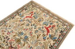 Surface texture of 2000s Tabriz rug with natural Wool and intricate pattern