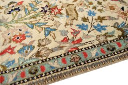 Backside of handmade 2000s Tabriz rug showing knot structure and weave density