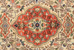 Corner detail of 1990s Tabriz rug showing border pattern and Wool pile