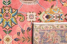 Close-up detail of 1980s Tabriz rug from Iran / Persia showing Wool weave