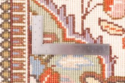 Corner detail of 2005s Tabriz rug showing border pattern and Wool pile