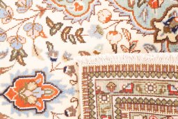 Close-up detail of 2005s Tabriz rug from Iran / Persia showing Wool weave