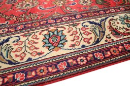 Backside of handmade 2000s Tabriz rug showing knot structure and weave density