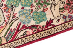 Backside of handmade 2000s Tabriz rug showing knot structure and weave density