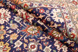Corner detail of 1985s Tabriz rug showing border pattern and Wool pile