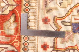 Corner detail of 2006s Tabriz rug showing border pattern and Wool pile