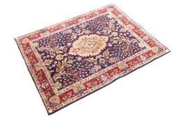 Corner detail of 2006s Tabriz rug showing border pattern and Wool pile