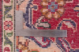 Corner detail of 2002s Tabriz rug showing border pattern and Wool pile