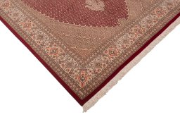 Corner detail of New Tabriz rug showing border pattern and Wool pile
