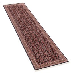 Corner detail of New Tabriz rug showing border pattern and Wool pile