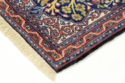 Backside of handmade 2000s Tabriz rug showing knot structure and weave density