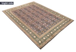 Corner detail of New Tabriz rug showing border pattern and Wool pile