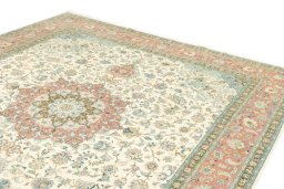 Surface texture of 2019s Tabriz rug with natural Wool and intricate pattern