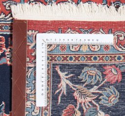 Corner detail of New Tabriz rug showing border pattern and Wool pile