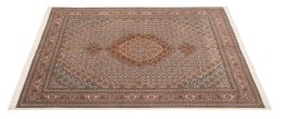 Corner detail of New Tabriz rug showing border pattern and Wool pile