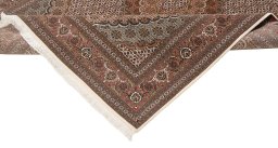 Backside of handmade New Tabriz rug showing knot structure and weave density
