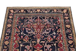 Surface texture of 1900s Tehran rug with natural Wool and intricate pattern