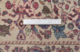 Corner detail of 1930s Tehran rug showing border pattern and Wool pile