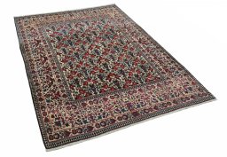 Corner detail of 1930s Tehran rug showing border pattern and Wool pile