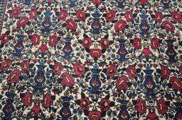 Backside of handmade 1930s Tehran rug showing knot structure and weave density