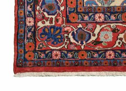 Backside of handmade 2000s Varamin rug showing knot structure and weave density