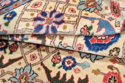 Close-up detail of 2000s Varamin rug from Iran / Persia showing Wool weave