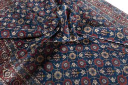 Corner detail of 1950s Varamin rug showing border pattern and Wool pile
