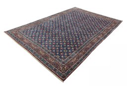 Corner detail of 1950s Varamin rug showing border pattern and Wool pile