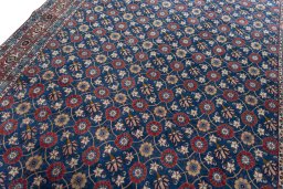 Backside of handmade 1950s Varamin rug showing knot structure and weave density