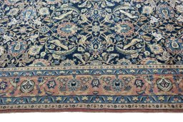 Corner detail of 2000s Varamin rug showing border pattern and Wool pile