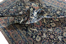 Surface texture of 2000s Varamin rug with natural Wool and intricate pattern