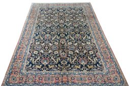 Surface texture of 2000s Varamin rug with natural Wool and intricate pattern
