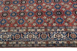 Corner detail of 1950s Varamin rug showing border pattern and Wool pile