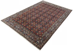 Corner detail of 1950s Varamin rug showing border pattern and Wool pile